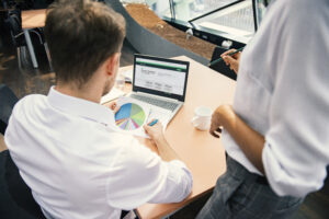 Advisor sitting at desk reviewing the Guaranty Guidepath FIA website and financial stats